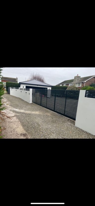 Modern slatted Automated gate and fence installation by IGS Systems