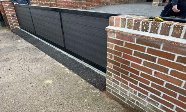 Automated gate with composite panel inserts by IGS Systems